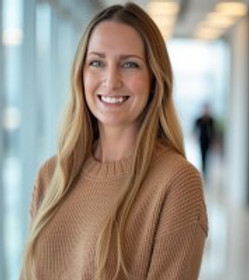 Ellen Jones headshot with a tan sweater